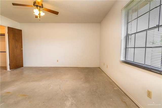 300 W Westway Ave, Mcallen, TX 78501 - unfurnished bedroom featuring concrete floors and ceiling fan
