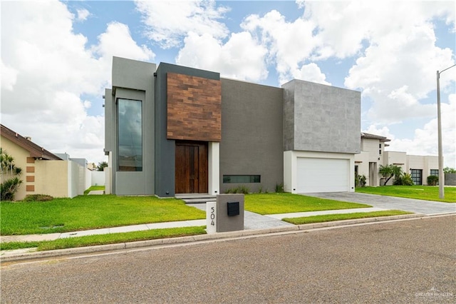 contemporary house with a garage and a front yard