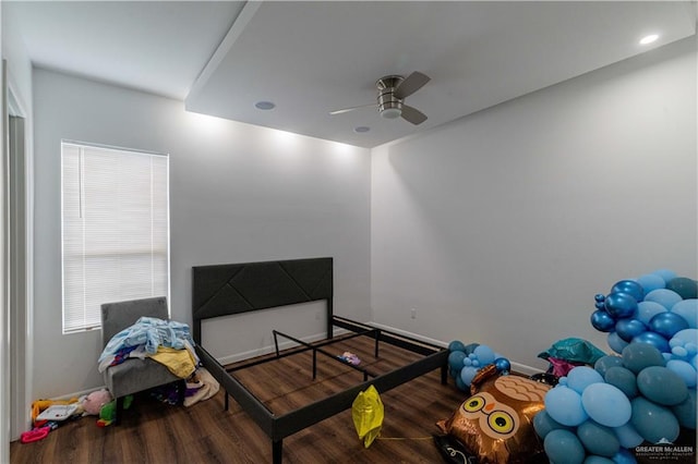 bedroom featuring hardwood / wood-style flooring and ceiling fan