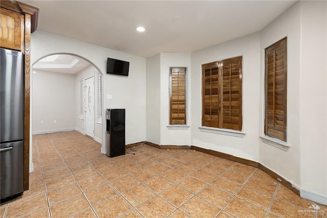 interior space with light tile patterned floors