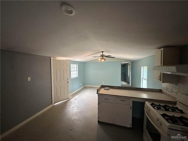 kitchen with ceiling fan, range hood, kitchen peninsula, vaulted ceiling, and white gas range oven