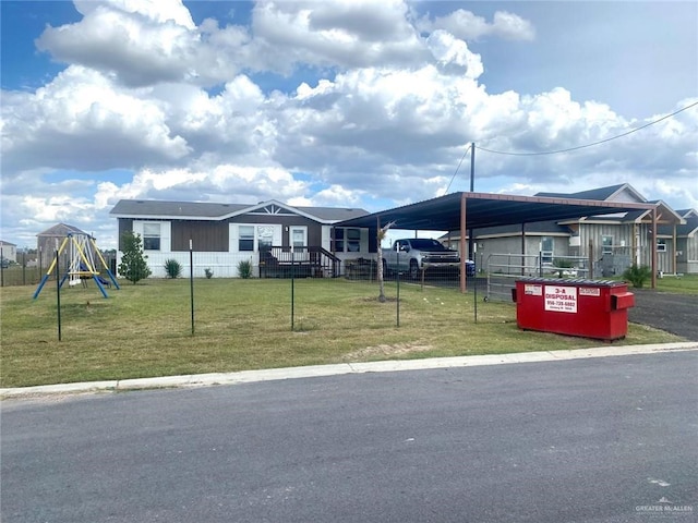 view of front of home featuring a front lawn and a carport