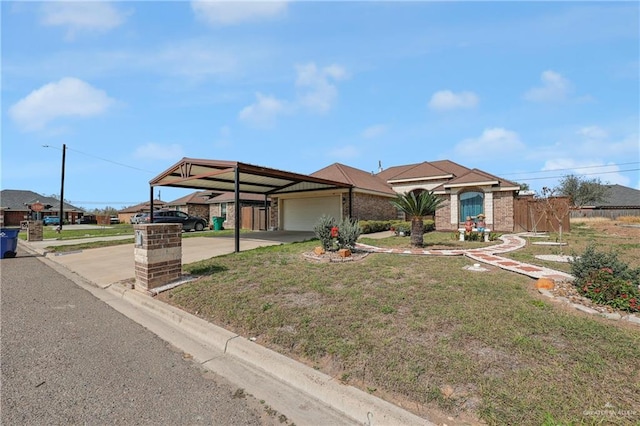 ranch-style home with a garage, a front yard, and a carport