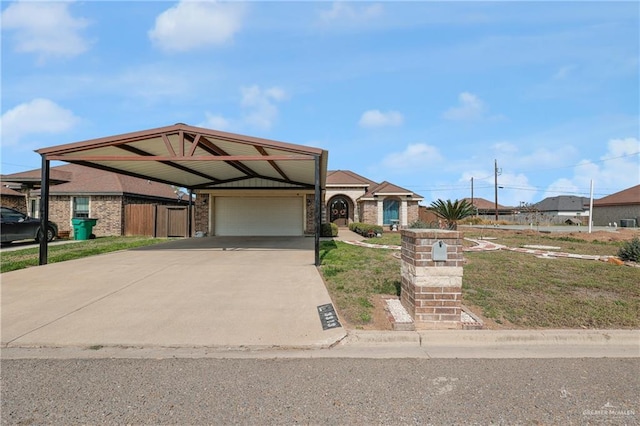 view of front facade featuring a carport and a garage