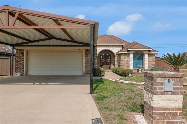 view of front of property featuring a carport and a garage