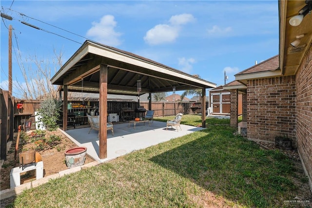 view of yard featuring a gazebo and a patio area