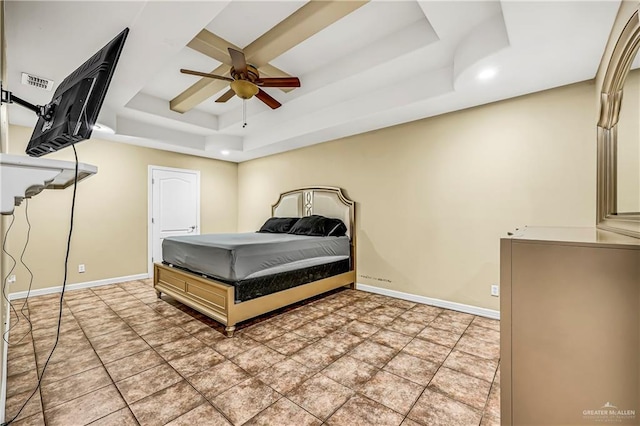 bedroom featuring ceiling fan and a tray ceiling