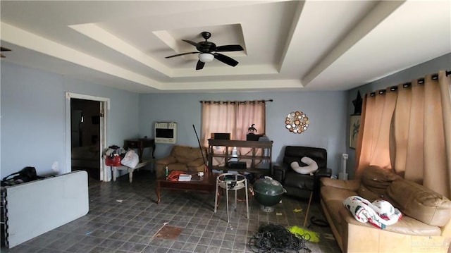 2313 E Walker Rd, Donna, TX 78537 - living area featuring a raised ceiling, a ceiling fan, and heating unit