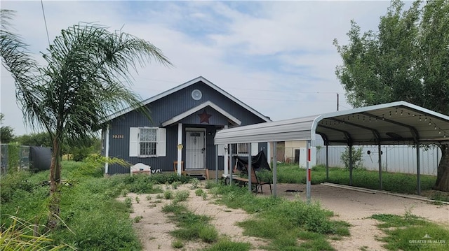 2313 E Walker Rd, Donna, TX 78537 - view of front of home featuring a carport and dirt driveway
