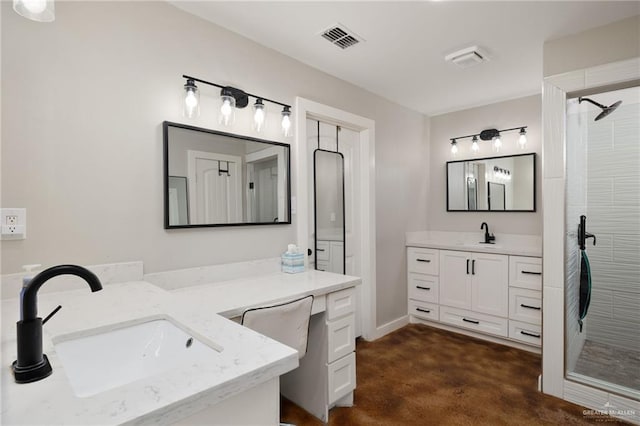 full bathroom with a stall shower, two vanities, a sink, and visible vents