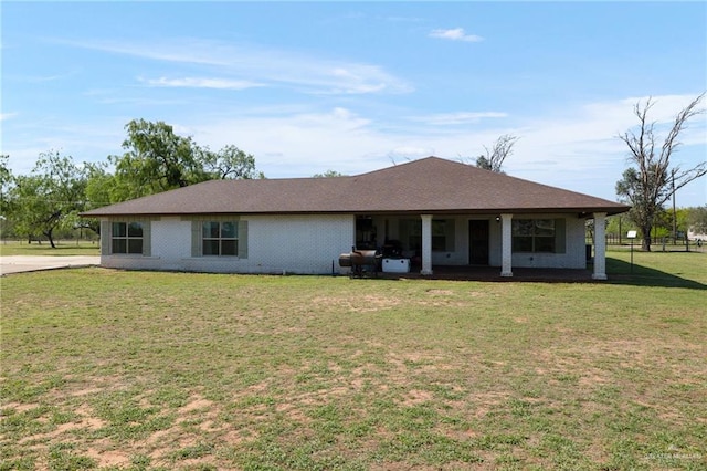 back of property with a yard