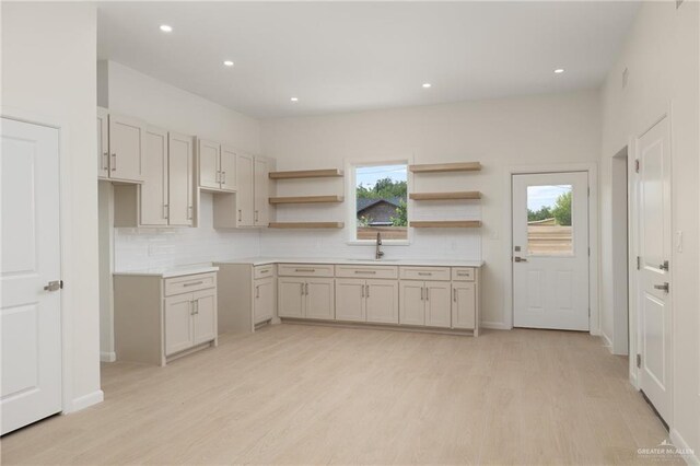 1204 N Lincoln Ave, San Juan, TX 78589 - kitchen featuring a sink, backsplash, light wood finished floors, recessed lighting, and open shelves