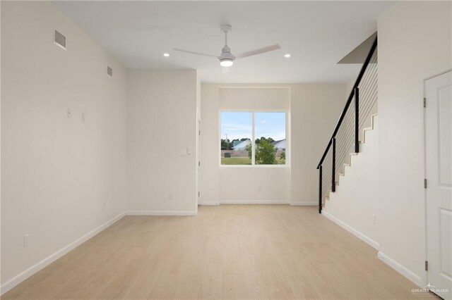 1204 N Lincoln Ave, San Juan, TX 78589 - unfurnished room featuring a ceiling fan, light wood-style floors, recessed lighting, stairs, and baseboards