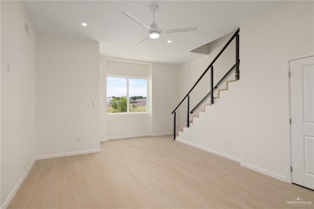1204 N Lincoln Ave, San Juan, TX 78589 - unfurnished living room with ceiling fan, stairs, light wood-style flooring, recessed lighting, and baseboards