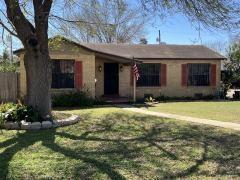 ranch-style house featuring a front lawn