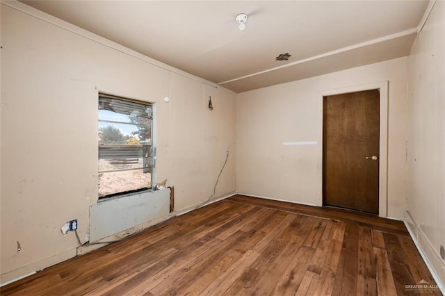 empty room featuring hardwood / wood-style flooring