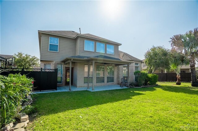 2405 San Alejandro St, Mission, TX 78572 - rear view of house featuring brick siding, a patio area, and ceiling fan