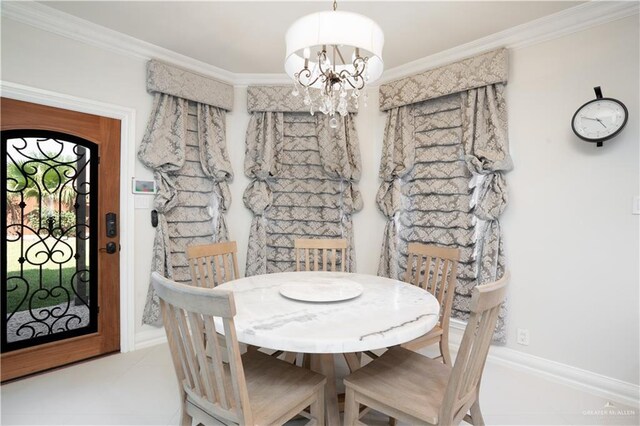 2405 San Alejandro St, Mission, TX 78572 - tiled dining space featuring ornamental molding, a chandelier, and baseboards