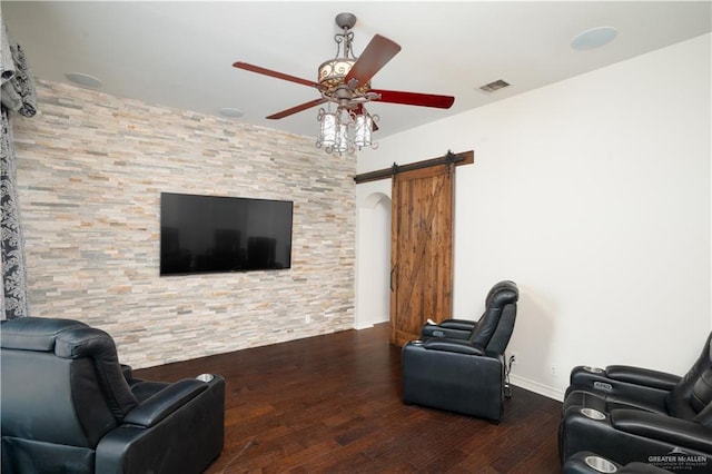 2405 San Alejandro St, Mission, TX 78572 - living area with a barn door, ceiling fan, wood finished floors, and baseboards