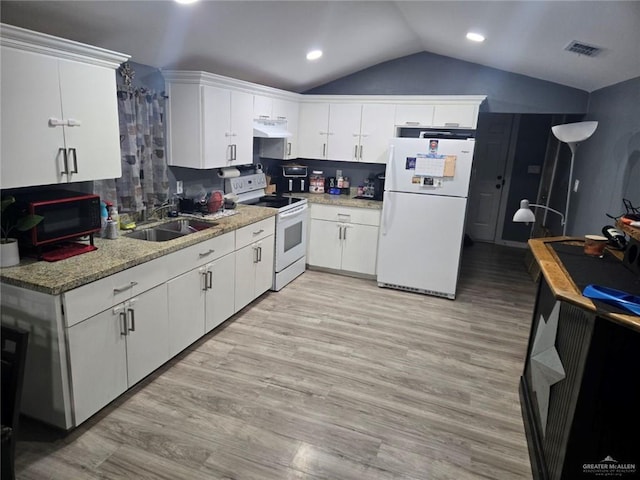 kitchen featuring backsplash, white appliances, white cabinetry, and vaulted ceiling