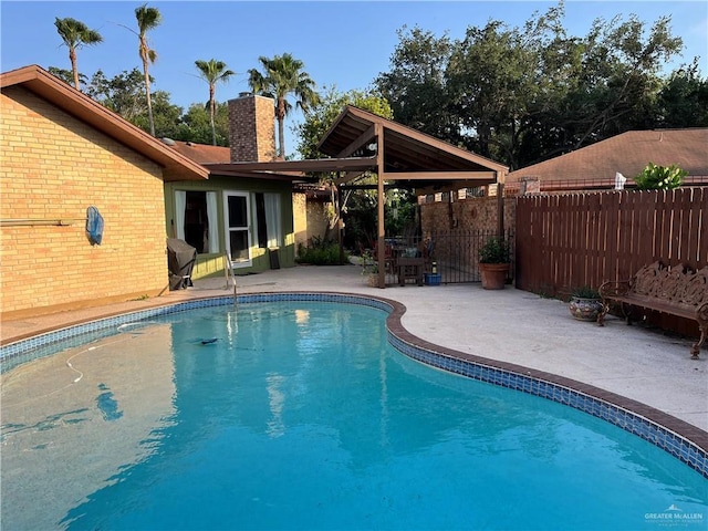 view of swimming pool with a fenced in pool, fence, a patio, and a gazebo
