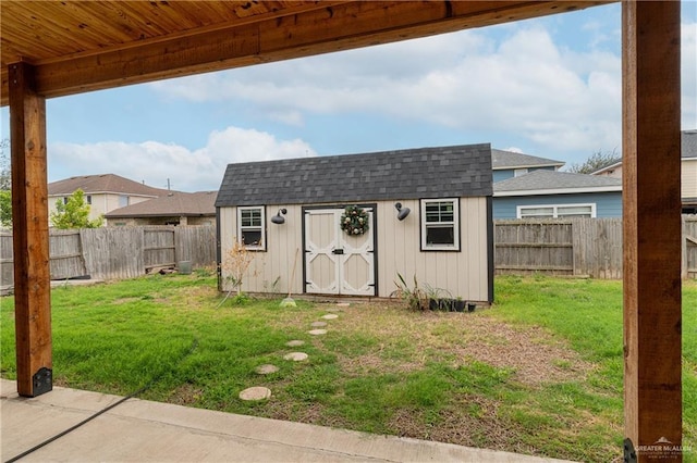 view of shed featuring a fenced backyard