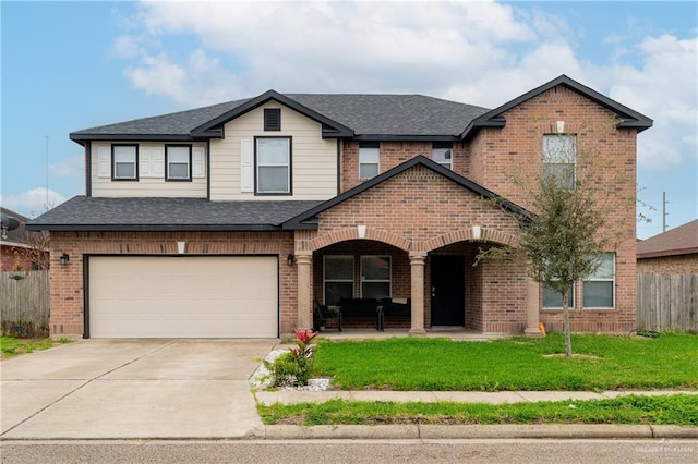 view of front of property featuring brick siding, fence, driveway, and a front lawn