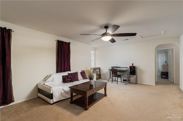 living room with baseboards, attic access, visible vents, and carpet flooring