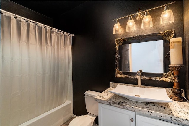 bathroom with shower / tub combo, vanity, and toilet