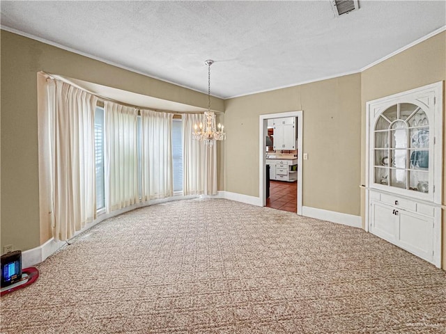 interior space with crown molding, carpet floors, a textured ceiling, and a chandelier