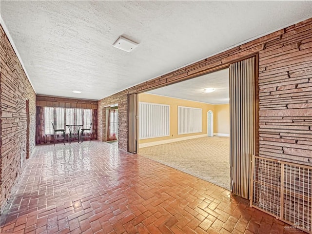 empty room featuring a textured ceiling