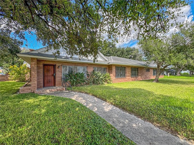 ranch-style house with a front lawn