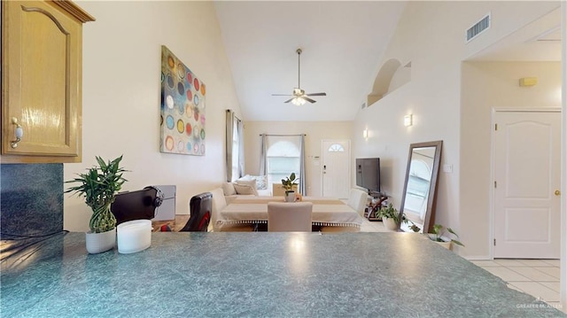 3810 W Sarah Evans St, Edinburg, TX 78541 - dining room with light tile patterned floors, high vaulted ceiling, a ceiling fan, and visible vents