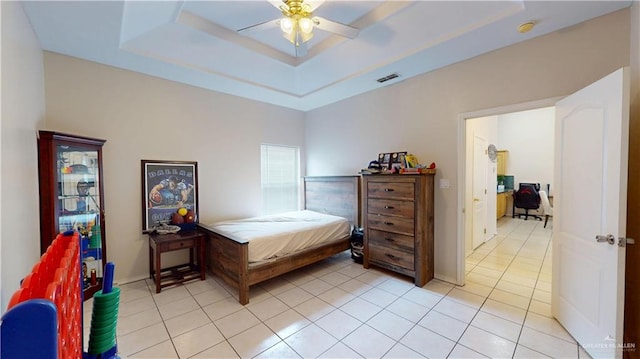 3810 W Sarah Evans St, Edinburg, TX 78541 - bedroom with light tile patterned floors, a raised ceiling, a ceiling fan, and visible vents