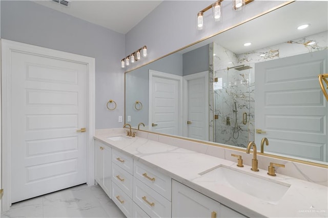 bathroom featuring vanity and a shower with shower door