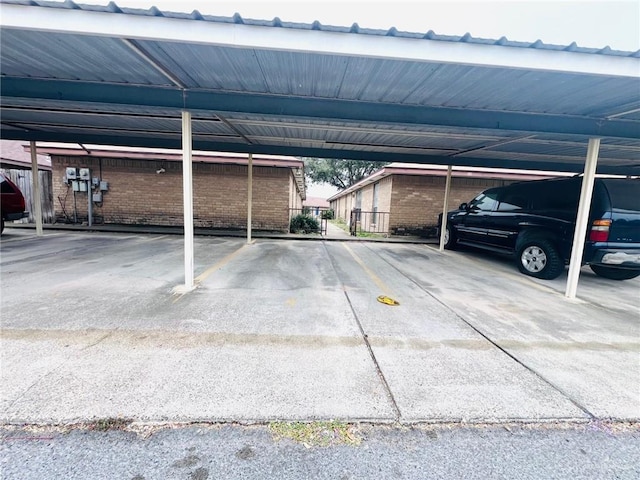 view of vehicle parking with a carport