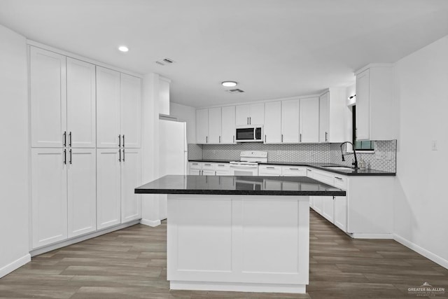 1315 Rio Guadalupe Cir, San Juan, TX 78589 - kitchen with white cabinetry, white appliances, and a sink