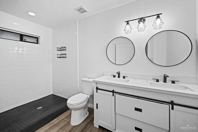 1315 Rio Guadalupe Cir, San Juan, TX 78589 - bathroom with toilet, double vanity, a sink, and visible vents