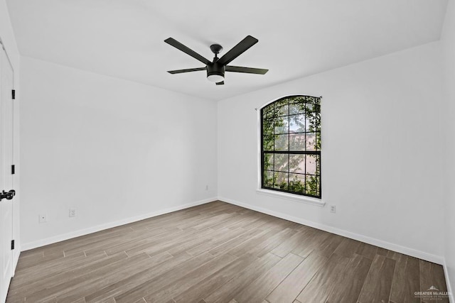 1315 Rio Guadalupe Cir, San Juan, TX 78589 - unfurnished room with wood finished floors, ceiling fan, and baseboards