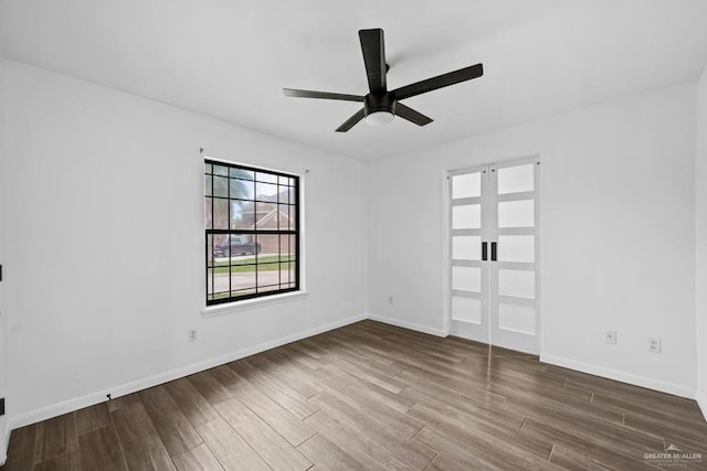 1315 Rio Guadalupe Cir, San Juan, TX 78589 - spare room featuring ceiling fan, wood finished floors, and baseboards