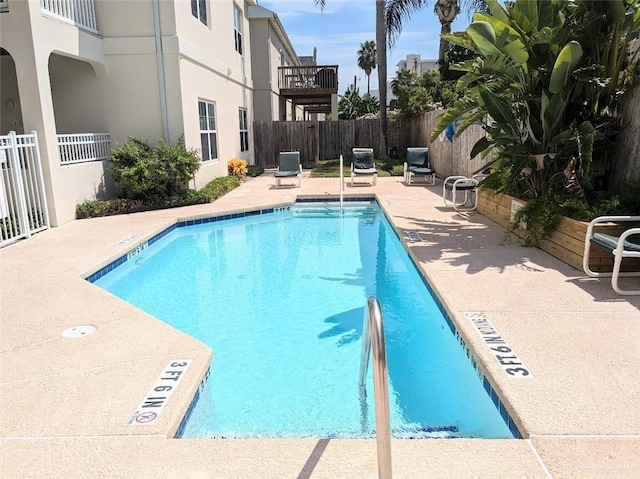 109 E Retama St Unit 2, South Padre Island, TX 78597 - community pool with a patio area, a fenced backyard, and central air condition unit