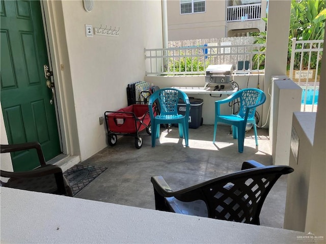 109 E Retama St Unit 2, South Padre Island, TX 78597 - view of patio / terrace with a grill and fence