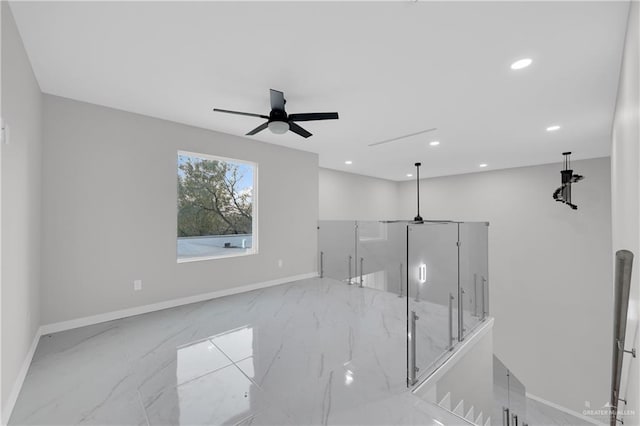 unfurnished room featuring ceiling fan