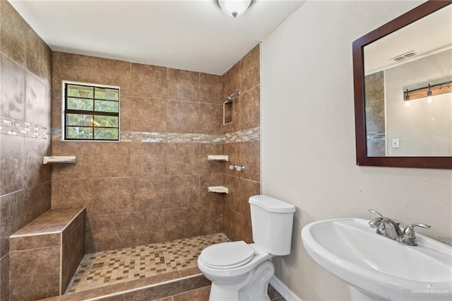 8006 Senecio St, Mission, TX 78574 - full bathroom featuring a tile shower