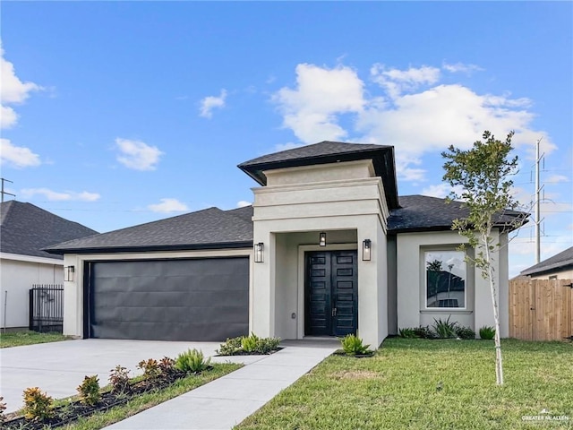 612 Yoli Ln, Donna, TX 78537 - view of front of property with a garage, a shingled roof, driveway, and stucco siding