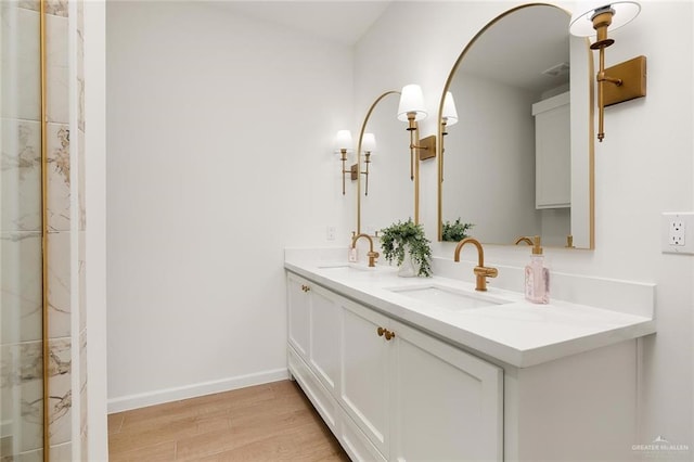 bathroom with hardwood / wood-style flooring and vanity