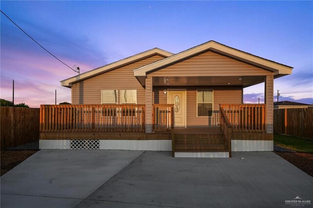 view of front of house featuring a porch and a deck