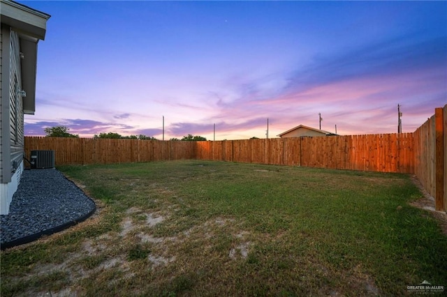 yard at dusk with central AC