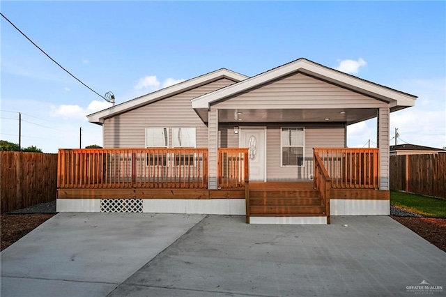 view of front of home featuring a wooden deck