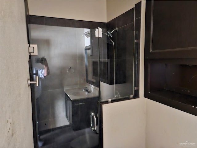 bathroom with vanity and walk in shower